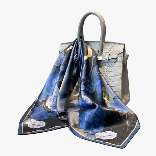 Silk foulard scarf featuring a vibrant blue floral print